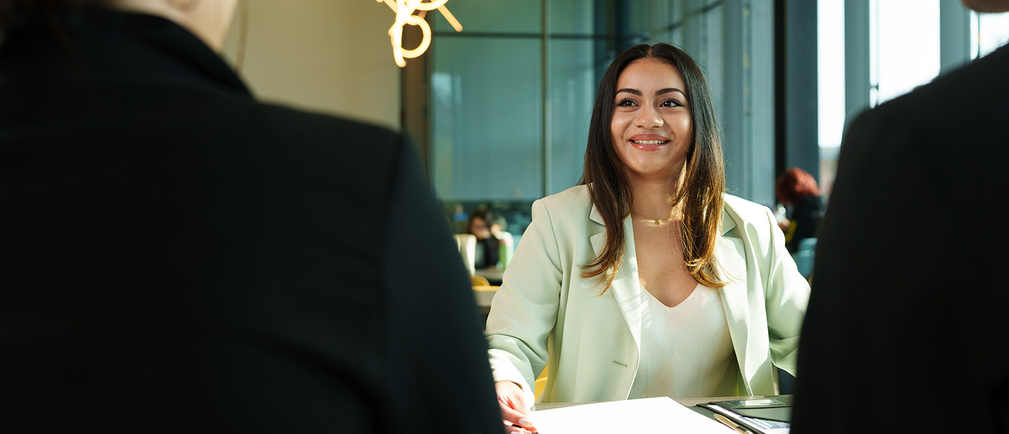 A woman meeting with business professionals