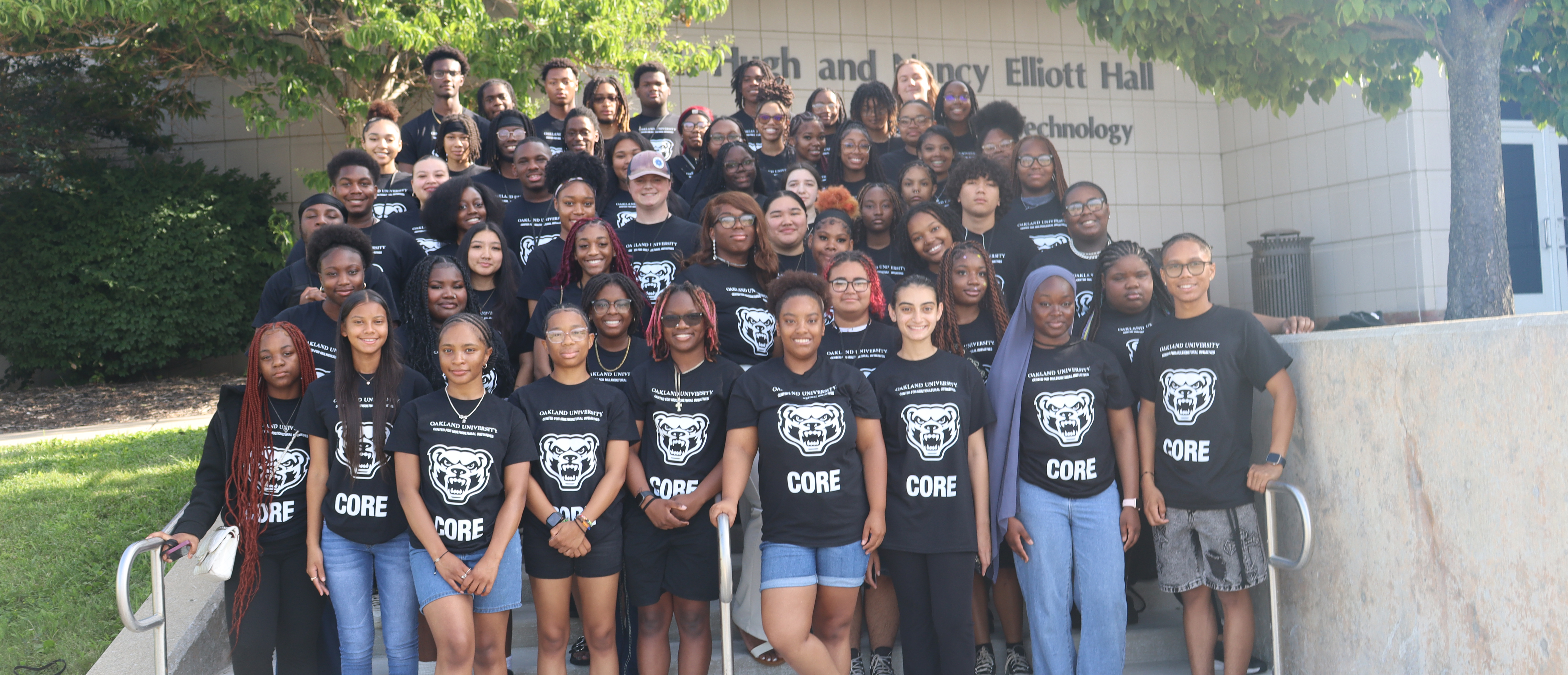 Group of CMI students smiling into camera