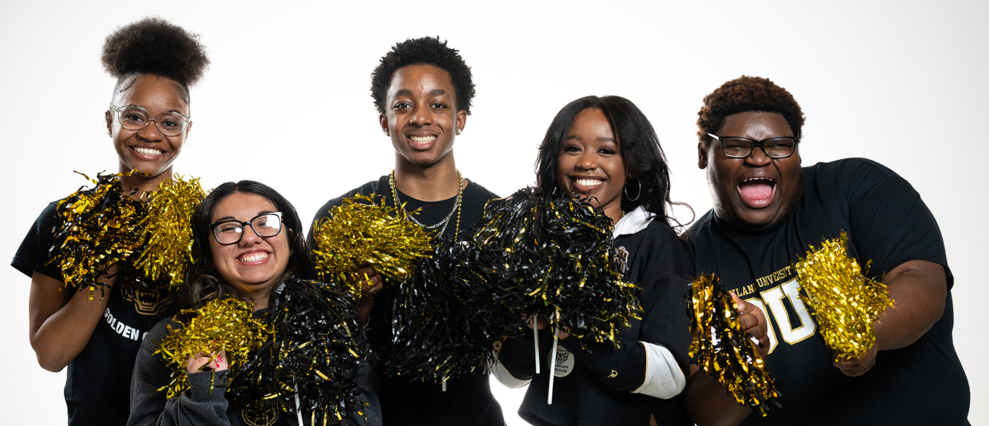 Students holding pompoms