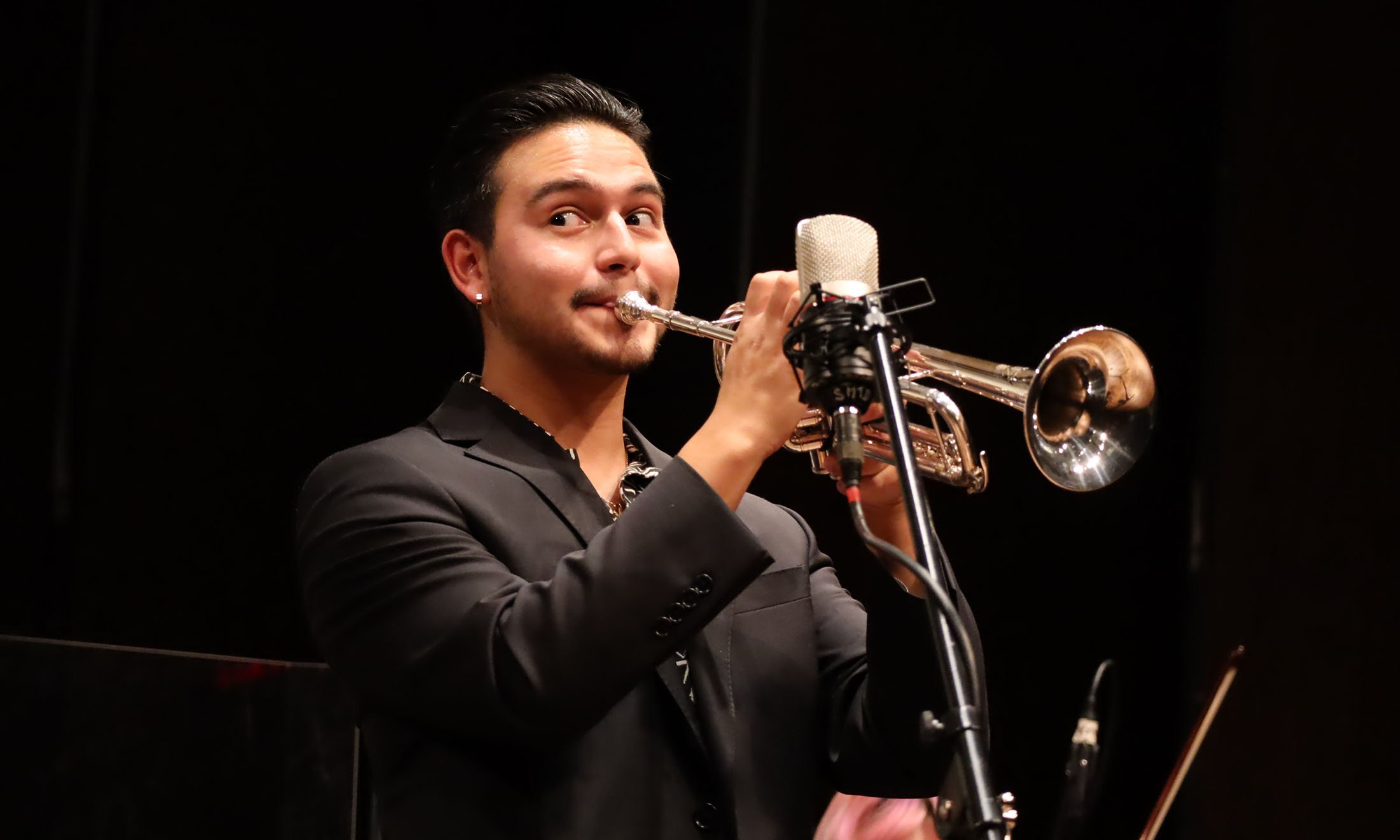 A person playing a trumpet