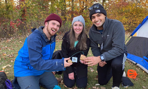 Three students at a MedWar event
