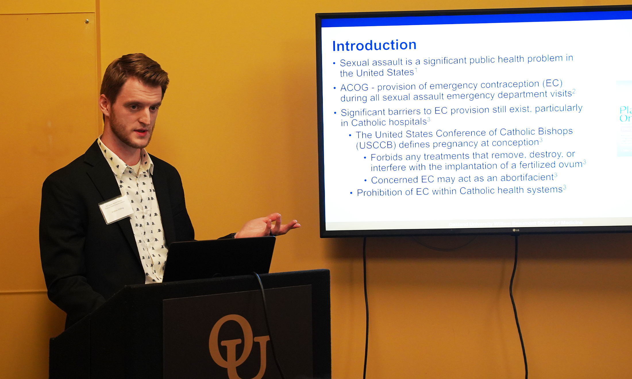 An image of a student at a podium