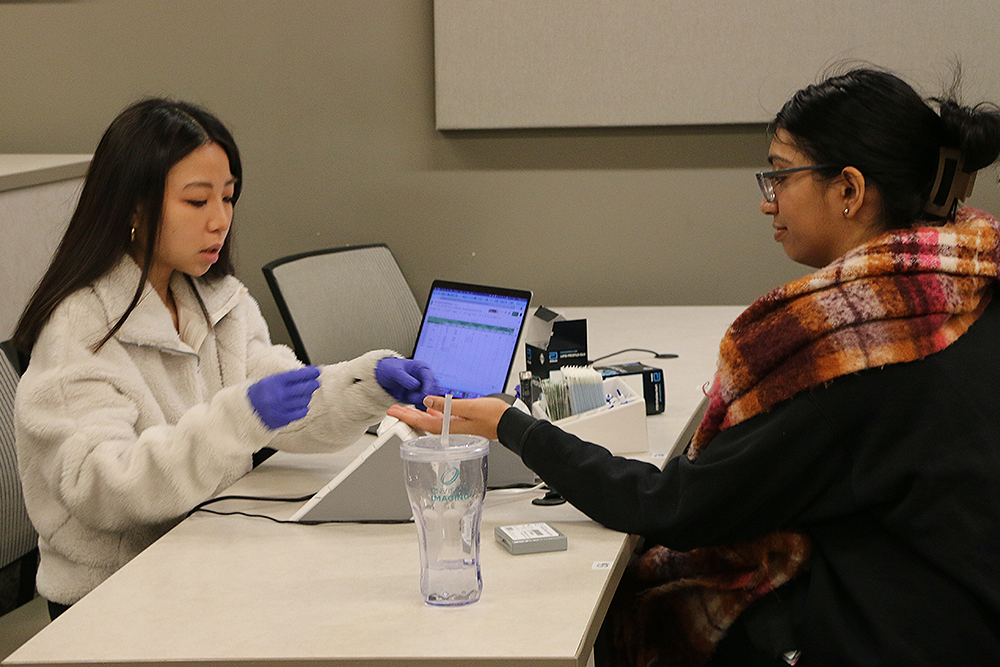 An image of a student checking another student