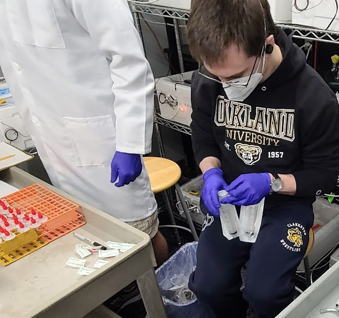 Kyle Spengler works in a lab