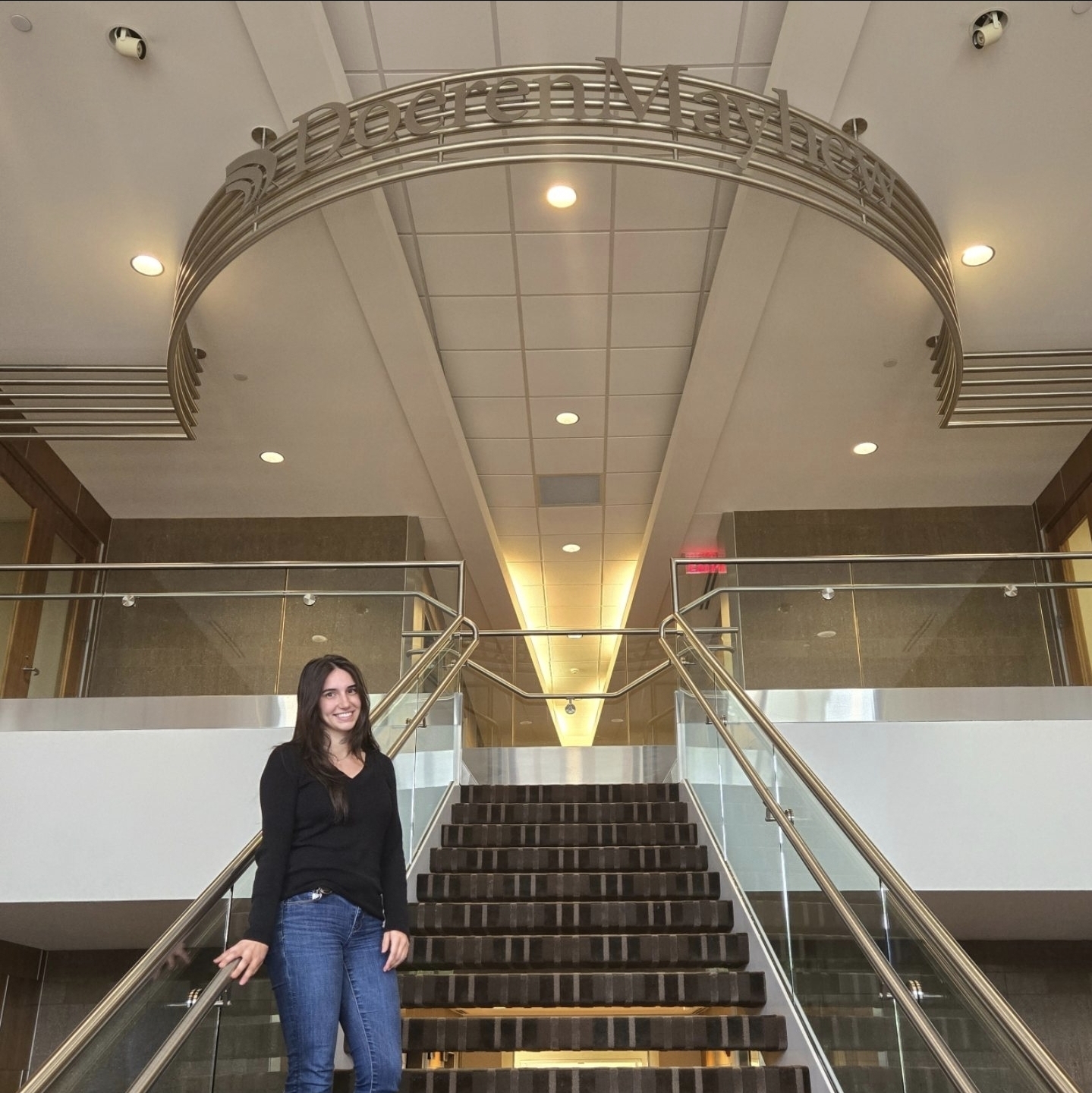 Student standing on staircase