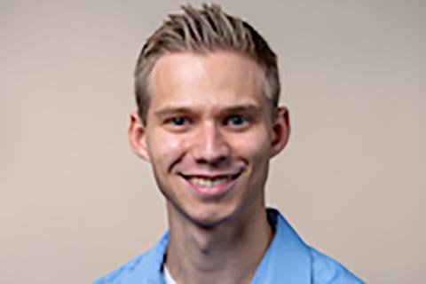 A headshot of Joshua Linneburg