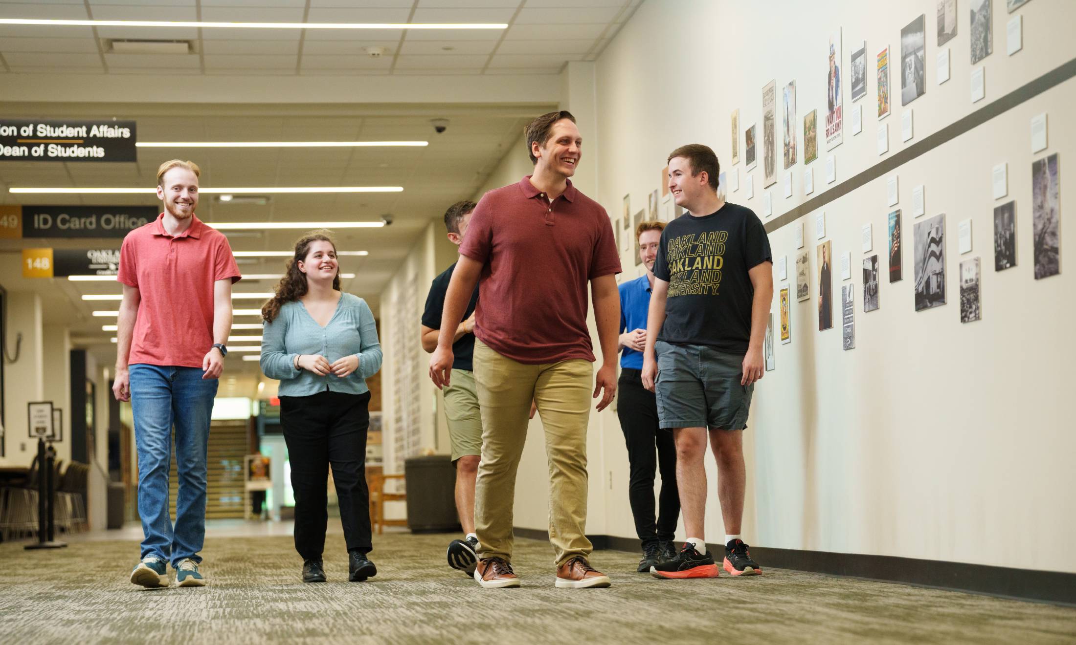 Students and professor next to history timeline