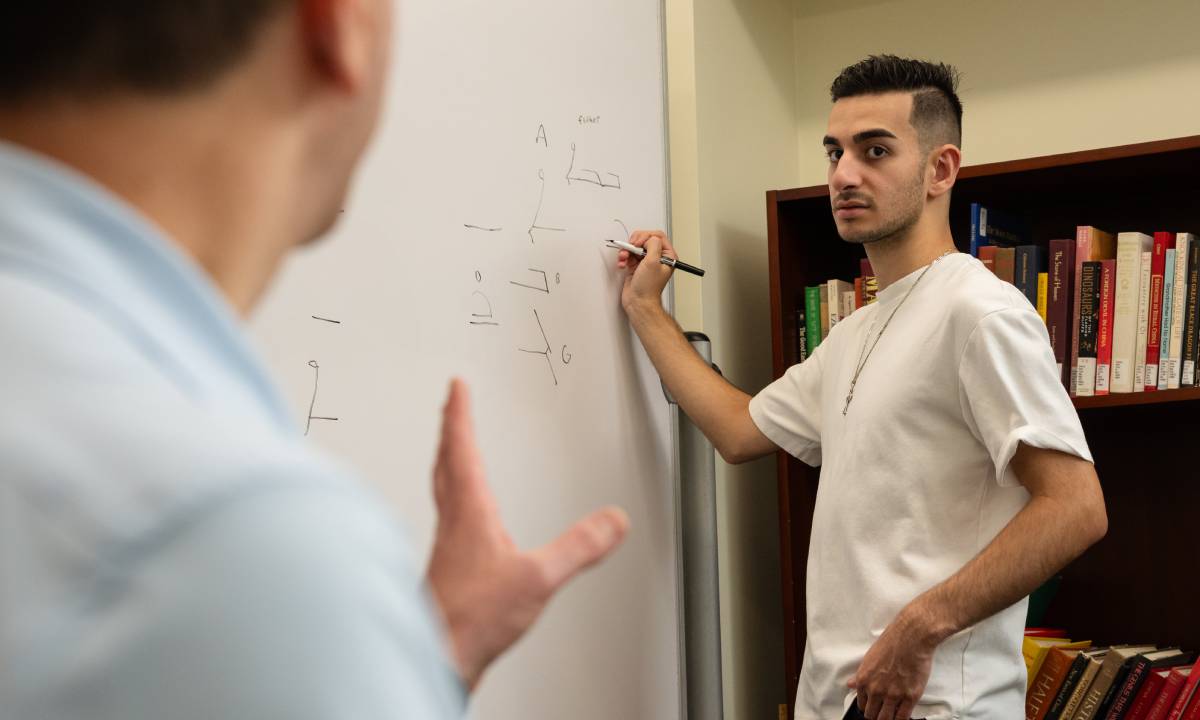 student at whiteboard