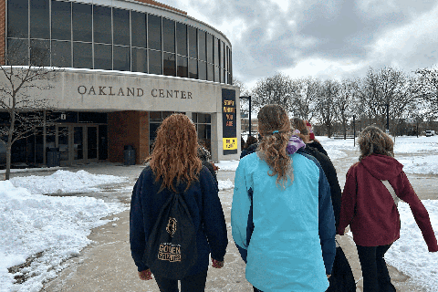 A group of students visiting Oakland University's campus