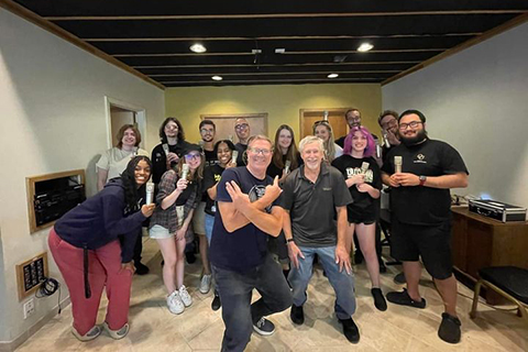 Students and faculty of the Music Technology program pose for the camera.