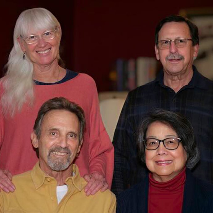 Two couples posing for a photo