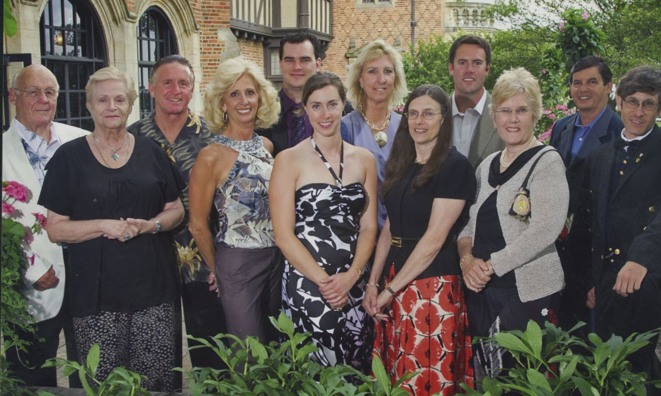 A family smiling outside