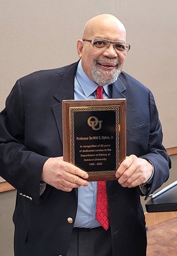 DeWitt Dykes holding an OU Award