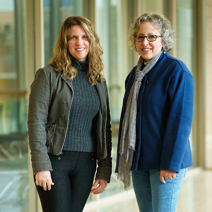 Two people in a hallway