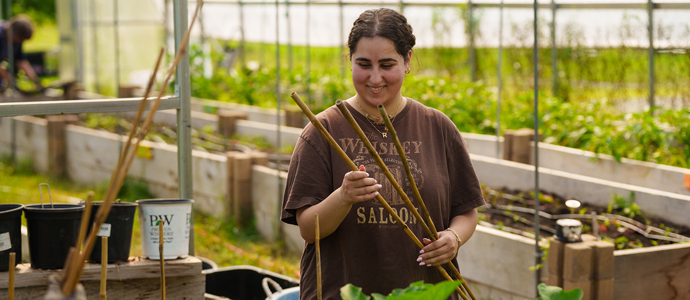 Woman working in greenhouse