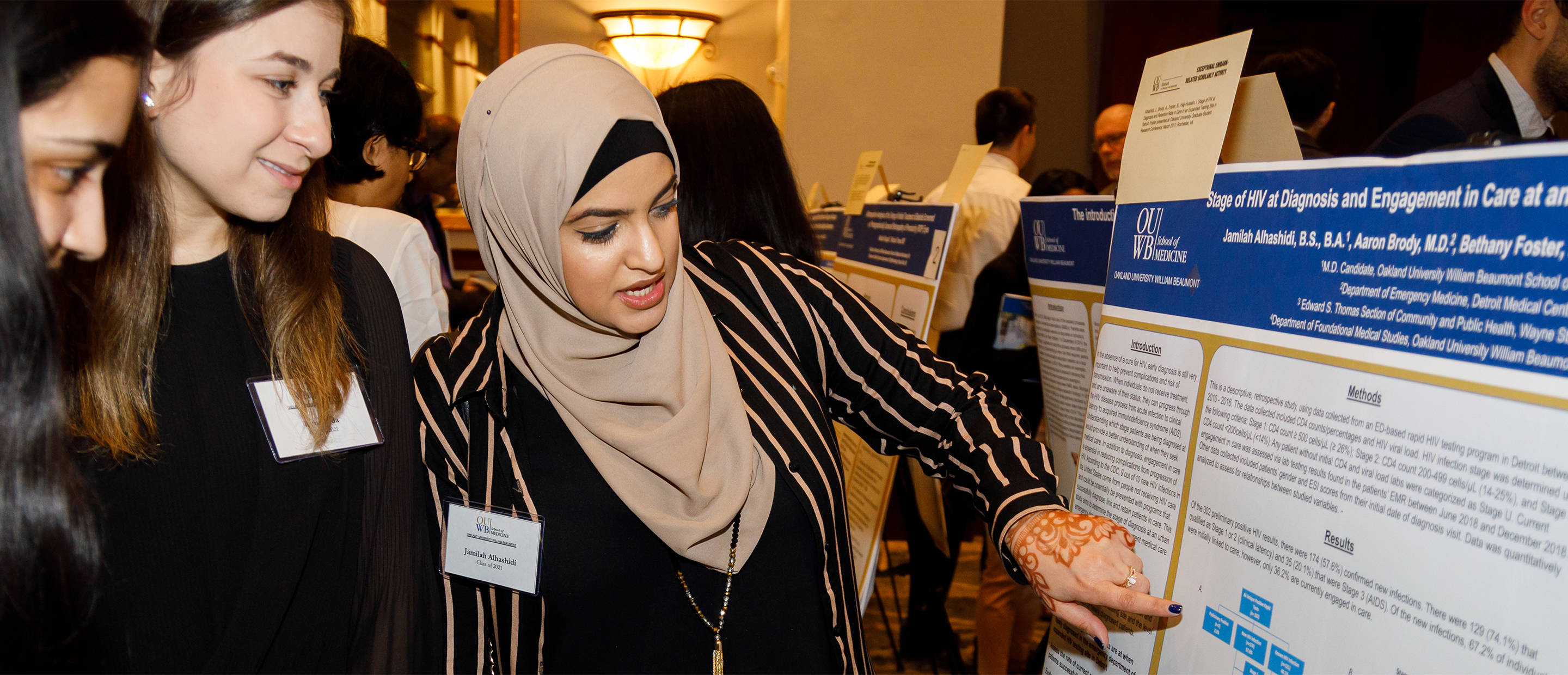 An image of students looking at a poster