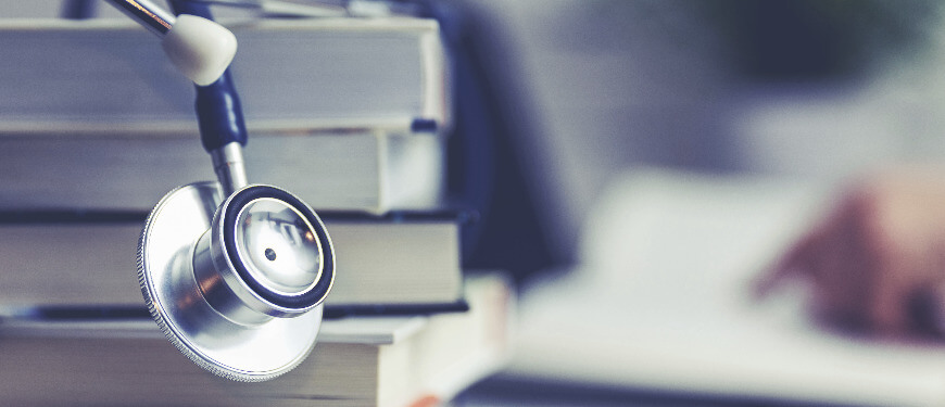 An image of a stethoscope and books