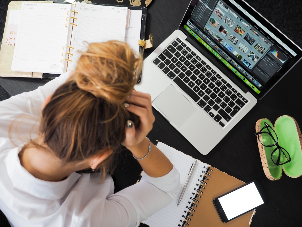 An image of a stressed person at a desk