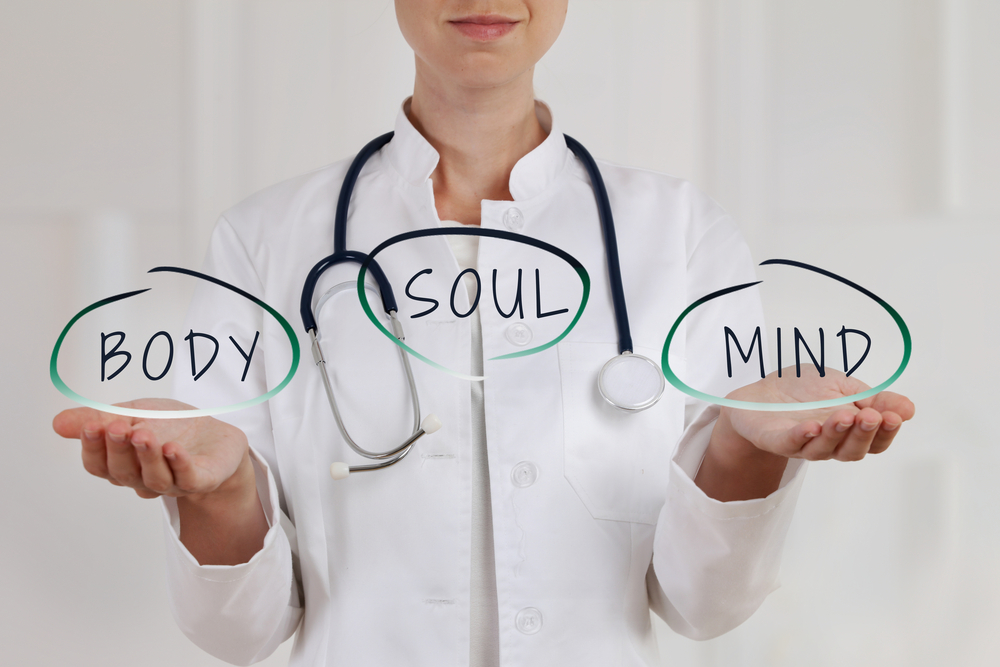 An image of a doctor holding signs