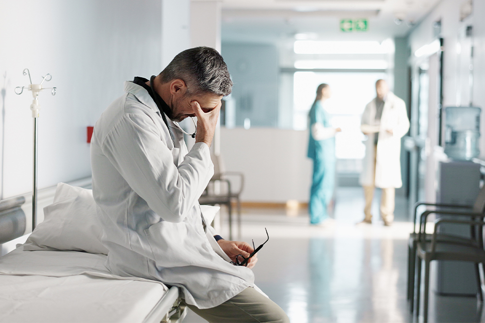 An image of a stressed doctor