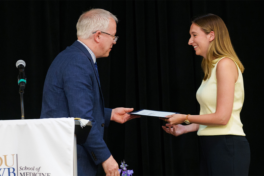 An image of a student receiving a certificate