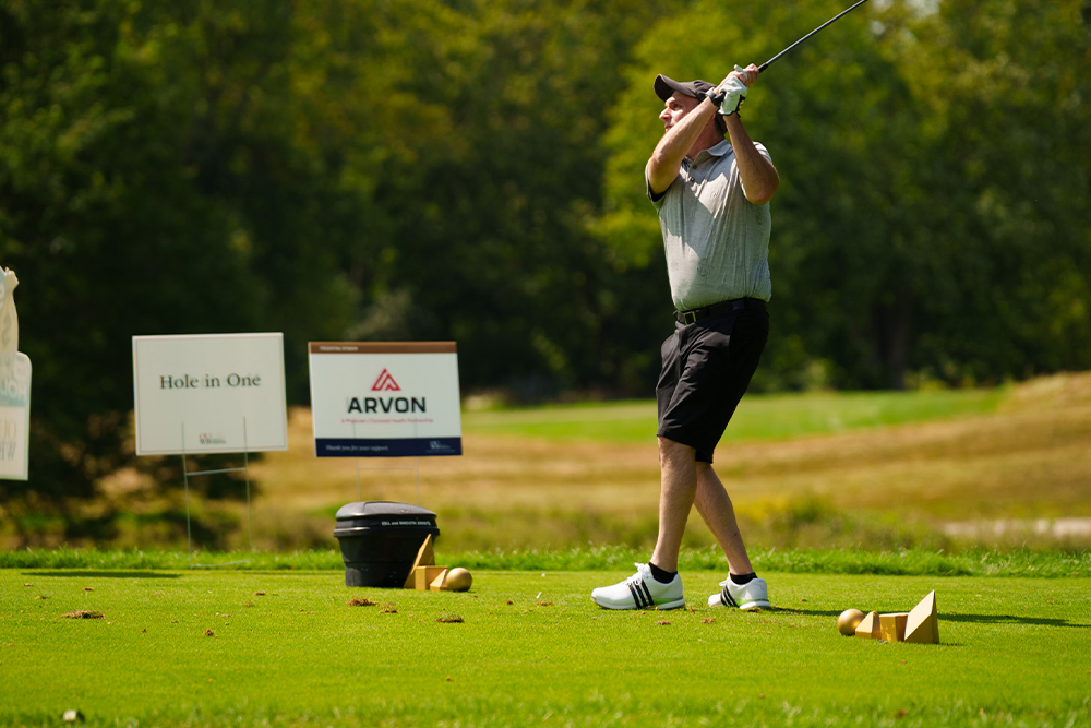 An image of Dr. Fisher golfing