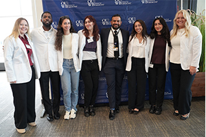 A group of admitted students and Dr. Krishnan pose for a picture