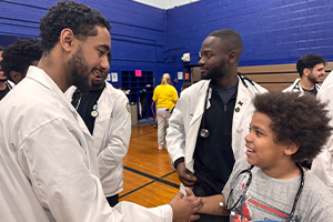 OUWB students interact with youth at the school