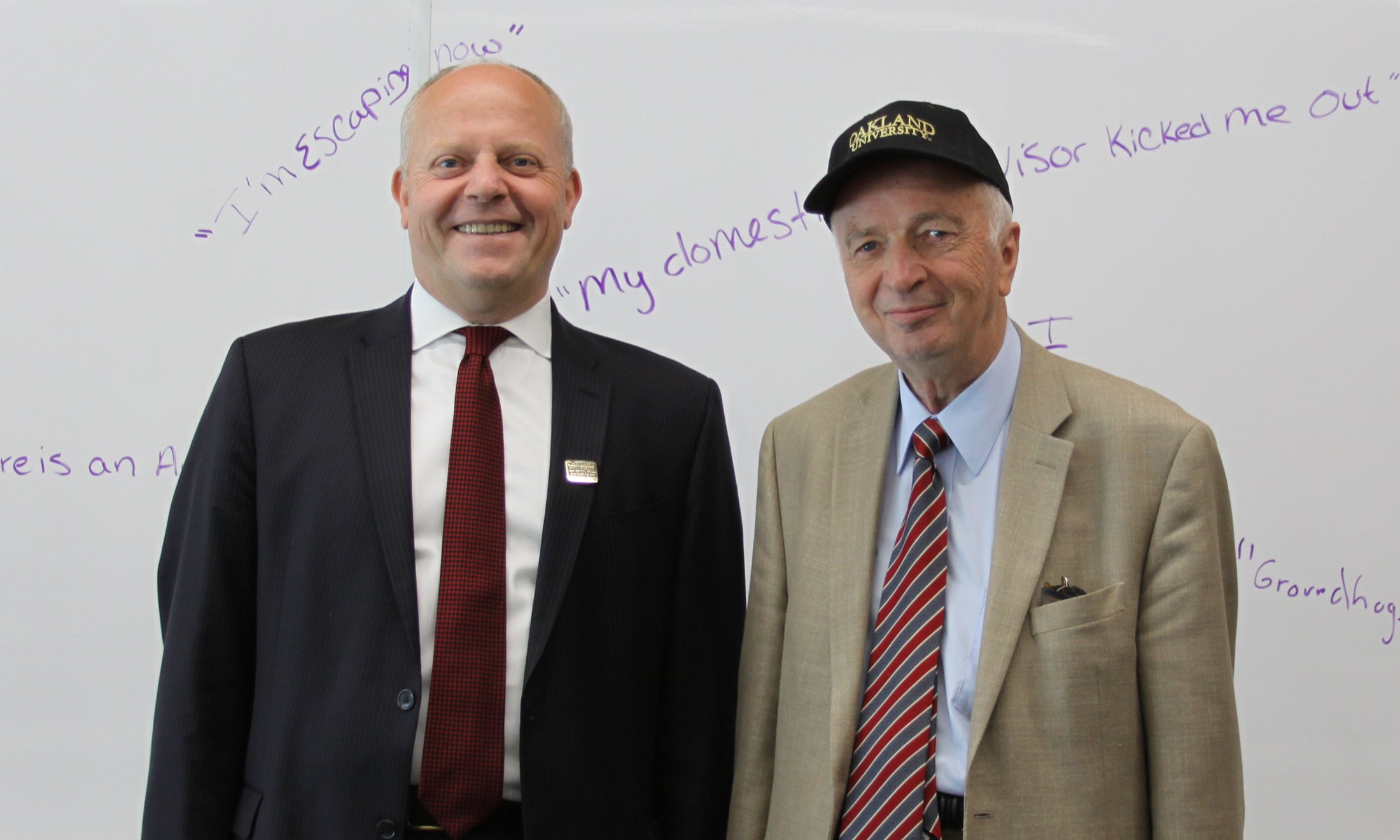 Image of Dr. Rusek and Dean Chamra celebrating