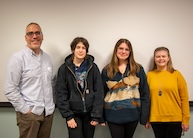 Professor Tuf Francis posing with a group of students