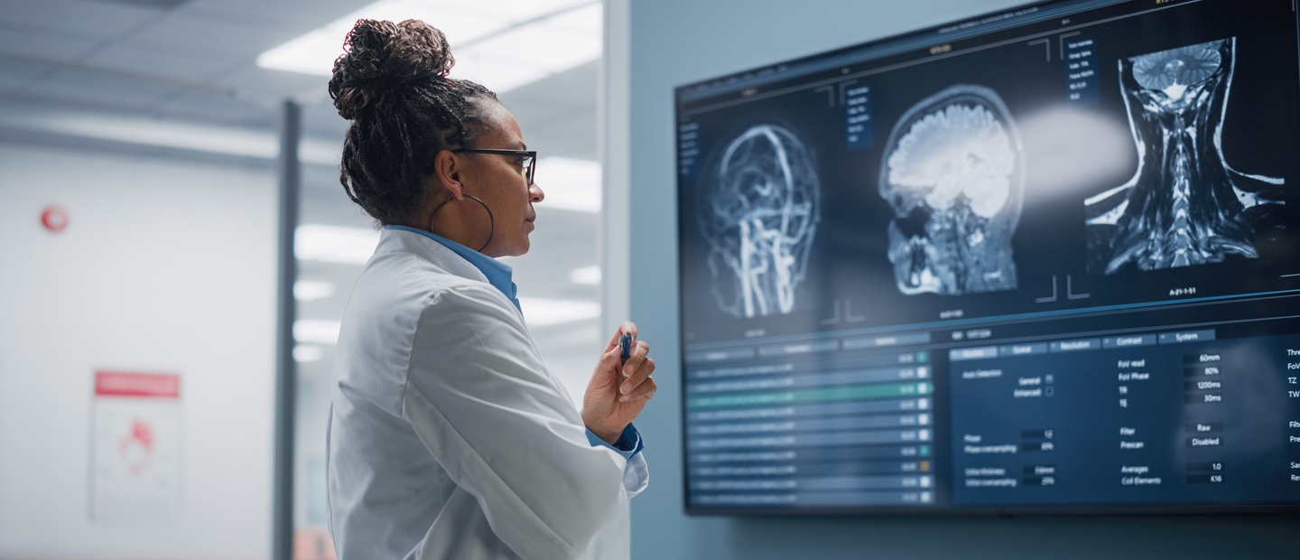 A doctor looking at electronic medical images.