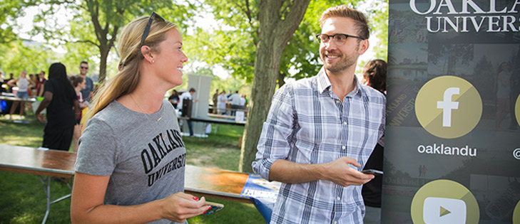 two students talking outdoors