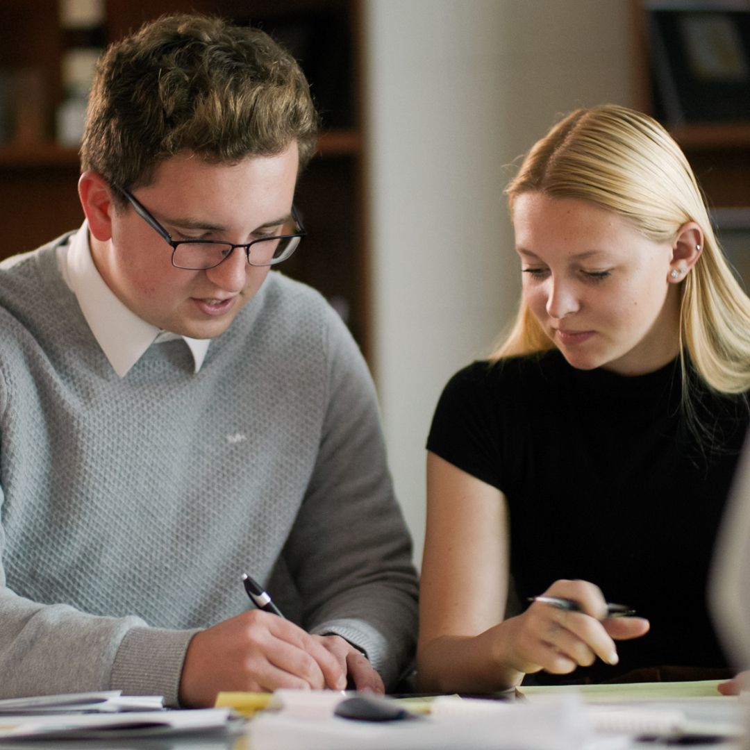 Two business students working together