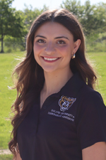 A professional headshot of Alanna L. in a black Oakland University shirt.