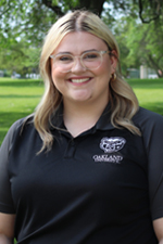 A professional headshot of Hannah Stanhope in a black Oakland University shirt.